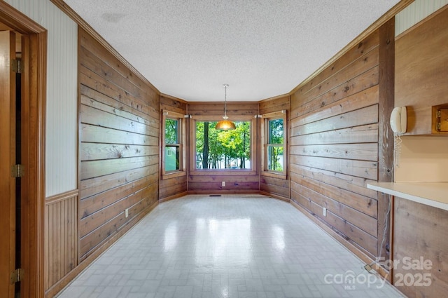 993 Jackson Rd, Fort Lawn, SC 29714 - empty room with ornamental molding, wood walls, and a textured ceiling