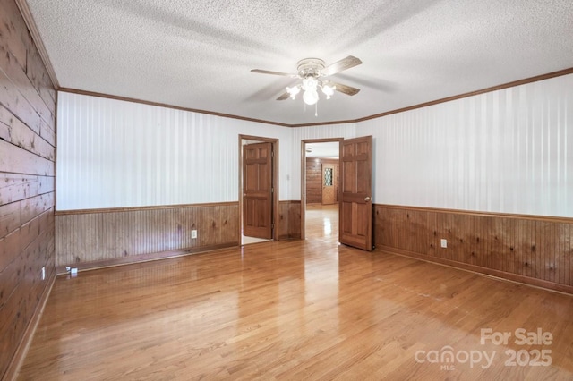 993 Jackson Rd, Fort Lawn, SC 29714 - unfurnished room with ornamental molding, wooden walls, and wood finished floors