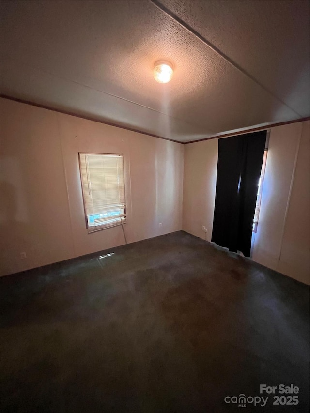 515 Willow St, Lincolnton, NC 28092 - spare room with carpet floors and a textured ceiling