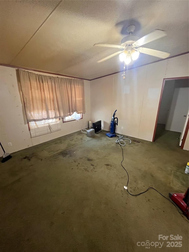 515 Willow St, Lincolnton, NC 28092 - interior space featuring a ceiling fan, a textured ceiling, and unfinished concrete flooring