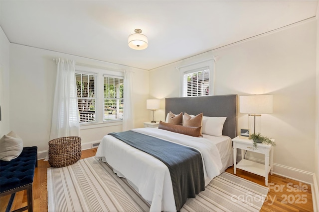 2015 Club Rd, Charlotte, NC 28205 - bedroom with baseboards, wood finished floors, and visible vents
