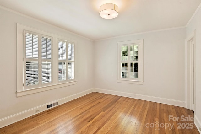2015 Club Rd, Charlotte, NC 28205 - empty room with baseboards, ornamental molding, light wood finished floors, and visible vents