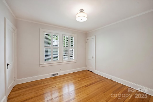 2015 Club Rd, Charlotte, NC 28205 - unfurnished room featuring baseboards, visible vents, ornamental molding, and light wood-style flooring