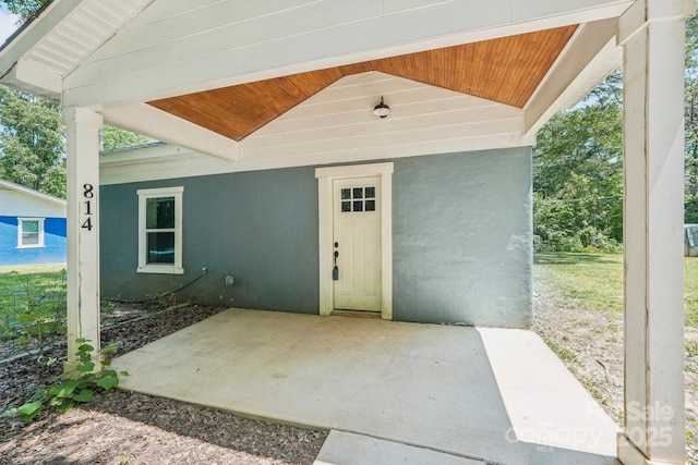 814 Marve St, Gastonia, NC 28052 - view of exterior entry with a patio area and stucco siding