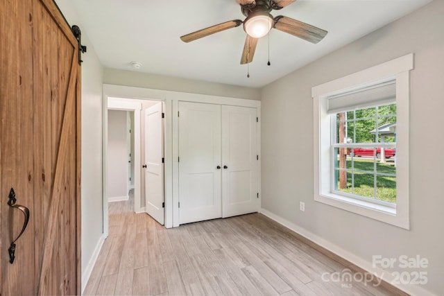 814 Marve St, Gastonia, NC 28052 - unfurnished bedroom with a closet, baseboards, ceiling fan, and light wood-style floors