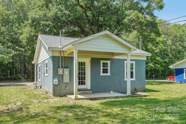 814 Marve St, Gastonia, NC 28052 - exterior space featuring roof with shingles, stucco siding, and a yard