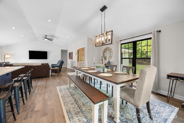 17403 Green Hill Rd, Charlotte, NC 28278 - dining area with vaulted ceiling, a chandelier, light wood-style flooring, baseboards, and ceiling fan