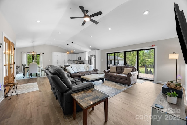 17403 Green Hill Rd, Charlotte, NC 28278 - living room with vaulted ceiling, wood finished floors, ceiling fan, and baseboards