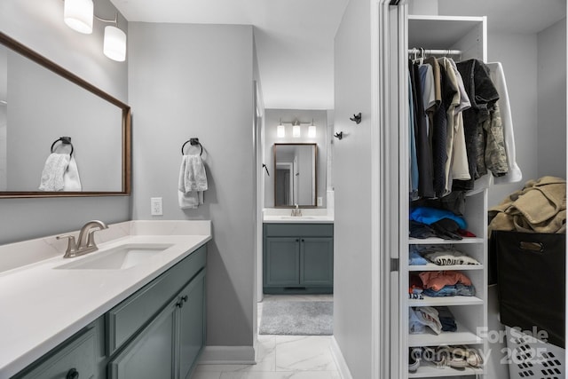 17403 Green Hill Rd, Charlotte, NC 28278 - full bath with marble look tiles, two vanities, a spacious closet, and baseboards