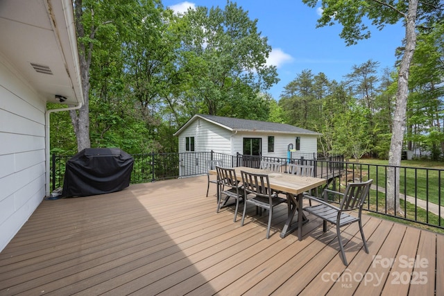 17403 Green Hill Rd, Charlotte, NC 28278 - wooden deck featuring outdoor dining area, a grill, and view of wooded area