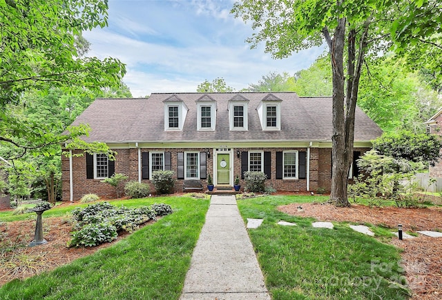 10209 Thomas Payne Cir, Charlotte, NC 28277 - cape cod home featuring brick siding, a front yard, and roof with shingles