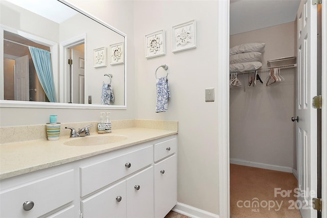 10209 Thomas Payne Cir, Charlotte, NC 28277 - bathroom featuring vanity and a walk in closet