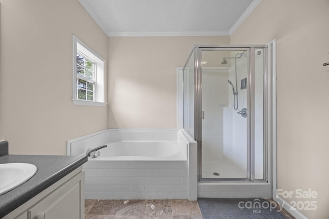 bathroom featuring crown molding, a shower stall, a garden tub, and vanity