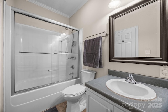 bathroom with crown molding, toilet, vanity, and enclosed tub / shower combo
