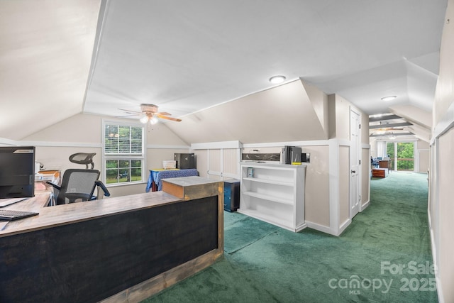 office space featuring lofted ceiling, ceiling fan, carpet flooring, and healthy amount of natural light