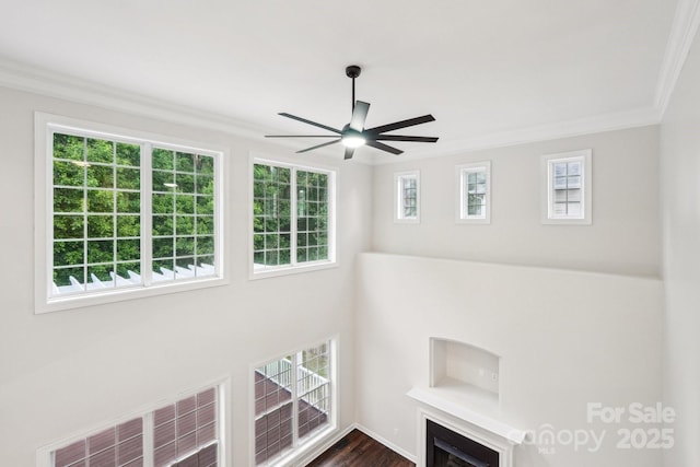 5745 Snapdragon Ln, Huntersville, NC 28078 - room details with ceiling fan, a fireplace, wood finished floors, visible vents, and ornamental molding