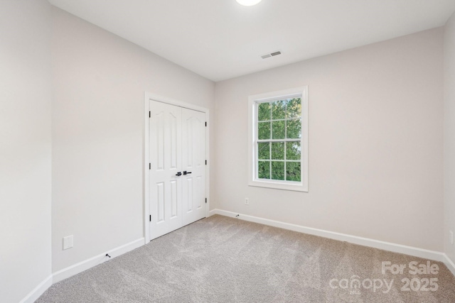 5745 Snapdragon Ln, Huntersville, NC 28078 - carpeted spare room featuring visible vents and baseboards