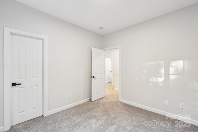 5745 Snapdragon Ln, Huntersville, NC 28078 - unfurnished bedroom with carpet floors and baseboards
