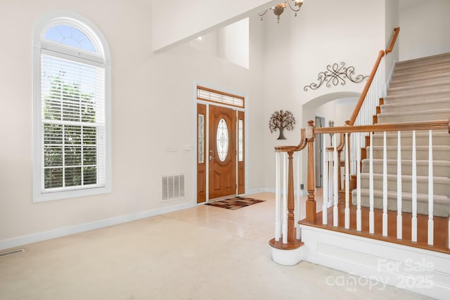 7525 Blackgum Falls Ct, Huntersville, NC 28078 - foyer entrance featuring visible vents, stairs, baseboards, and a healthy amount of sunlight