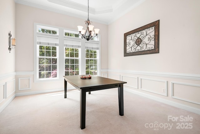 7525 Blackgum Falls Ct, Huntersville, NC 28078 - dining area with wainscoting, a notable chandelier, ornamental molding, carpet, and a decorative wall