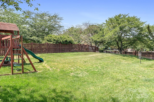 7525 Blackgum Falls Ct, Huntersville, NC 28078 - view of yard with a fenced backyard and a playground