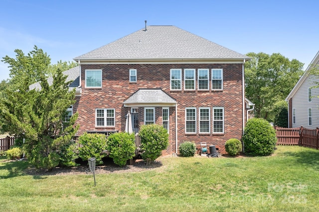 7525 Blackgum Falls Ct, Huntersville, NC 28078 - back of house featuring fence, a yard, roof with shingles, and brick siding