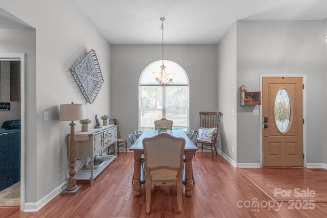 1800 Oriole Ct, Monroe, NC 28112 - dining room featuring baseboards, a notable chandelier, and wood finished floors