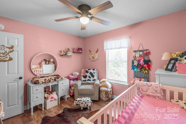 1800 Oriole Ct, Monroe, NC 28112 - bedroom with a textured ceiling, ceiling fan, and wood finished floors