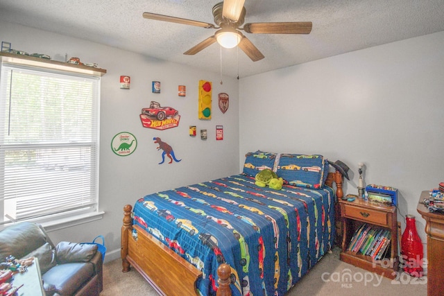 1800 Oriole Ct, Monroe, NC 28112 - bedroom featuring carpet floors, a ceiling fan, a textured ceiling, and multiple windows