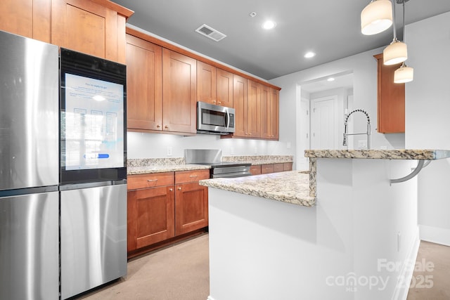kitchen featuring appliances with stainless steel finishes, light stone countertops, a peninsula, pendant lighting, and recessed lighting