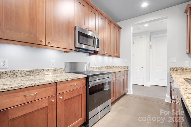 kitchen featuring stainless steel appliances, concrete flooring, recessed lighting, light stone countertops, and brown cabinets