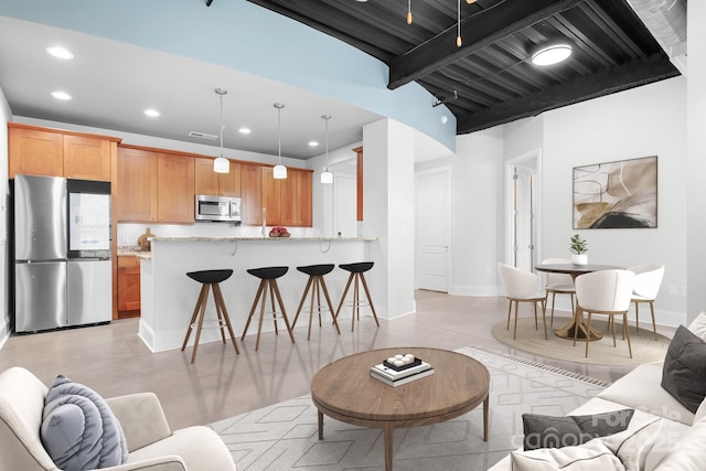 living area with recessed lighting, baseboards, concrete floors, and beam ceiling