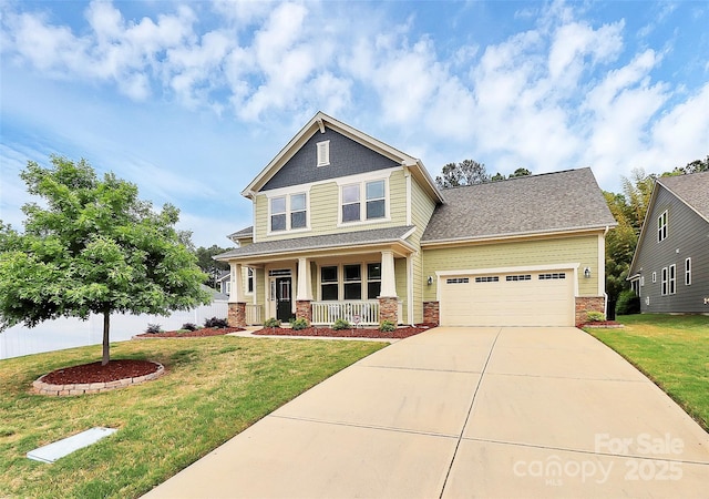 craftsman-style house with a porch, driveway, a front yard, brick siding, and an attached garage