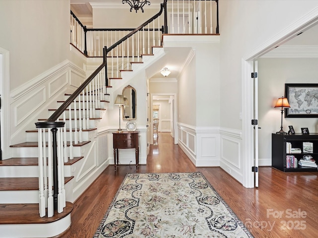 4701 Pineland Pl, Charlotte, NC 28277 - entryway with stairs, a decorative wall, a wainscoted wall, and wood finished floors