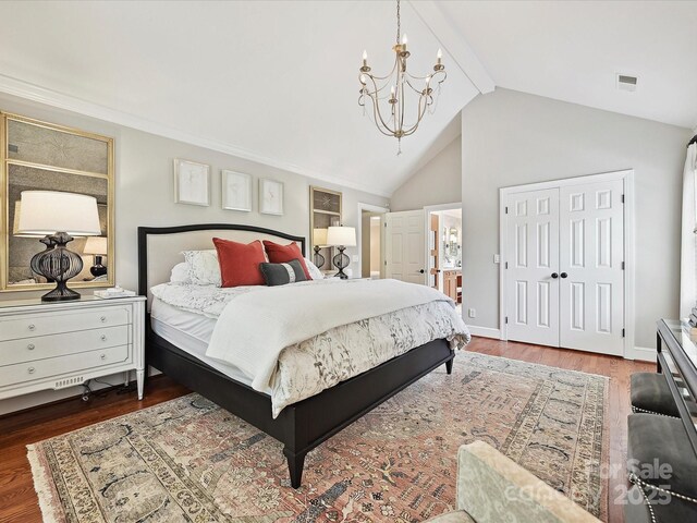 4701 Pineland Pl, Charlotte, NC 28277 - bedroom featuring wood finished floors, high vaulted ceiling, a notable chandelier, visible vents, and baseboards
