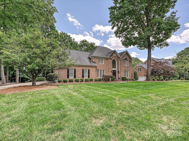 4701 Pineland Pl, Charlotte, NC 28277 - colonial inspired home featuring a front lawn and brick siding