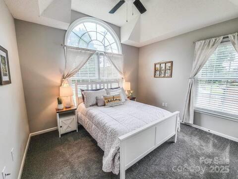 6231 Kentwood Dr, Kannapolis, NC 28081 - bedroom featuring dark colored carpet and a ceiling fan