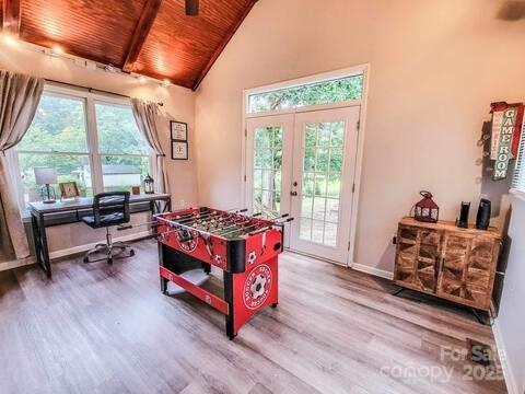 6231 Kentwood Dr, Kannapolis, NC 28081 - recreation room featuring wood finished floors, wooden ceiling, plenty of natural light, an office area, and french doors