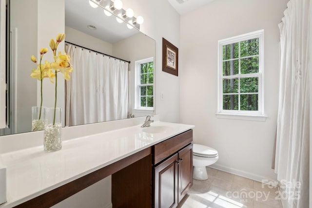 full bath featuring toilet, baseboards, tile patterned flooring, and vanity