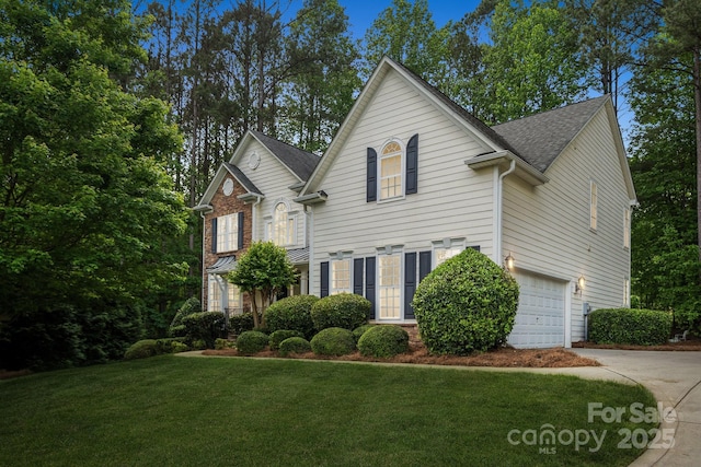 109 Braxton Gate Ct, Mount Holly, NC 28120 - traditional home with driveway, a front yard, an attached garage, and a shingled roof