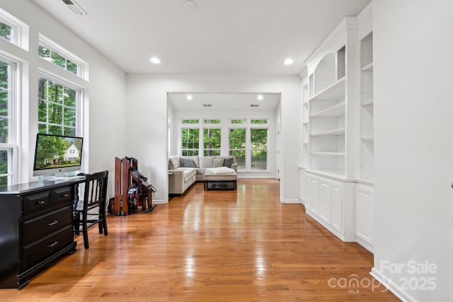 109 Braxton Gate Ct, Mount Holly, NC 28120 - living room featuring plenty of natural light, light wood-type flooring, recessed lighting, a desk, and baseboards