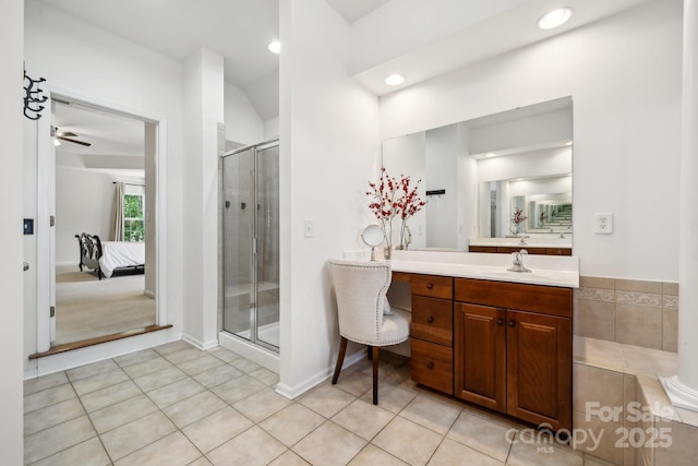 109 Braxton Gate Ct, Mount Holly, NC 28120 - ensuite bathroom featuring a shower stall, tile patterned flooring, recessed lighting, vanity, and ceiling fan