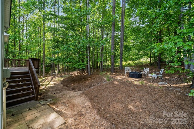 109 Braxton Gate Ct, Mount Holly, NC 28120 - view of yard featuring a deck and stairs