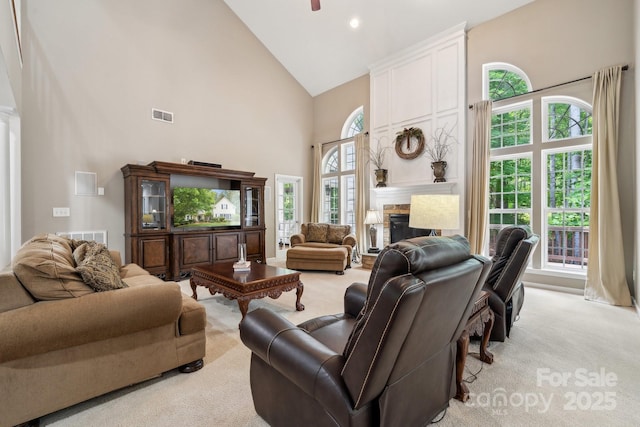 109 Braxton Gate Ct, Mount Holly, NC 28120 - living area with high vaulted ceiling, light colored carpet, a fireplace, a ceiling fan, and recessed lighting