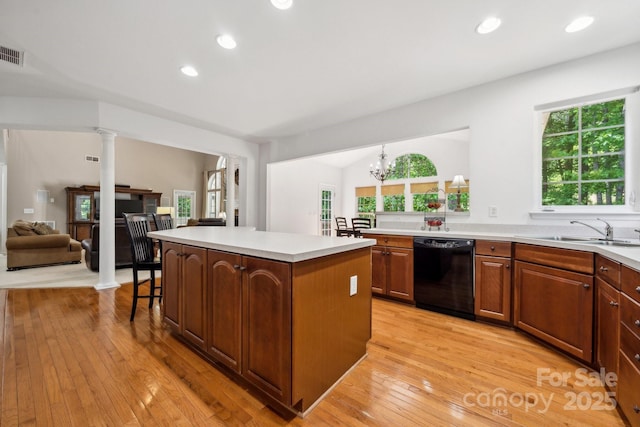 109 Braxton Gate Ct, Mount Holly, NC 28120 - kitchen featuring dishwasher, a kitchen island, healthy amount of natural light, light wood finished floors, and recessed lighting