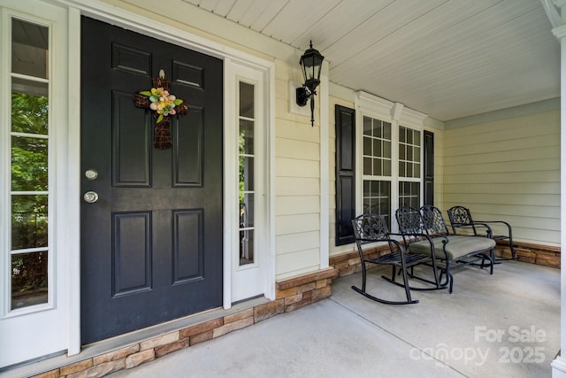 109 Braxton Gate Ct, Mount Holly, NC 28120 - view of exterior entry with a porch