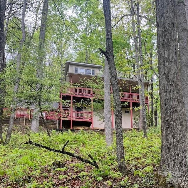 180 Rebel Ridge Rd, Maggie Valley, NC 28751 - rear view of house with a wooden deck