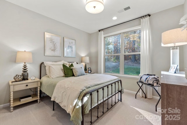 carpeted bedroom featuring baseboards, recessed lighting, and visible vents