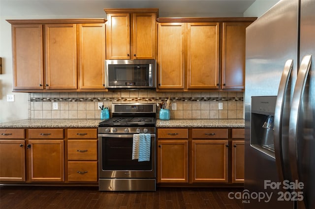 3186 Helmsley Ct, Concord, NC 28027 - kitchen featuring light stone counters, decorative backsplash, dark wood-style flooring, and stainless steel appliances