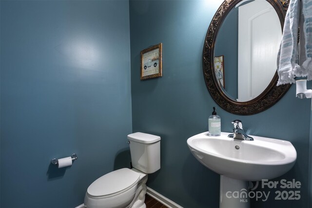 3186 Helmsley Ct, Concord, NC 28027 - half bath with baseboards, a sink, and toilet